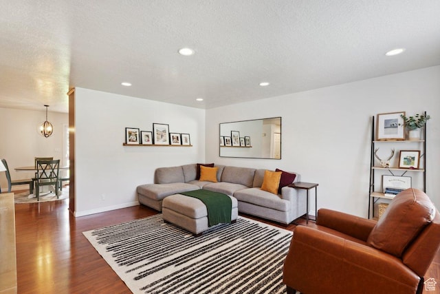 435 E 2100 N, North Ogden, UT 84414 - living room featuring dark wood-style flooring, recessed lighting, a chandelier, and a textured ceiling