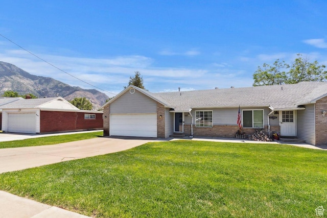 435 E 2100 N, North Ogden, UT 84414 - single story home with brick siding, an attached garage, concrete driveway, a mountain view, and a front lawn