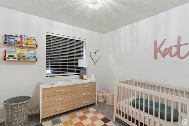 435 E 2100 N, North Ogden, UT 84414 - carpeted bedroom featuring a nursery area and a textured ceiling