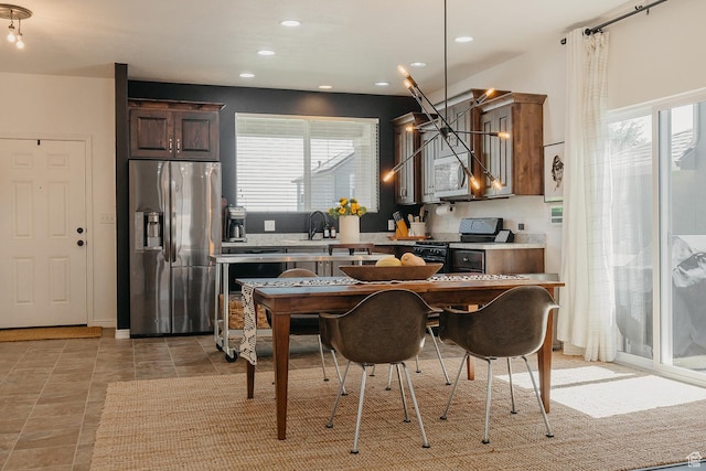 480 Firestone Dr, Santaquin, UT 84655 - kitchen featuring stainless steel fridge, range, light countertops, plenty of natural light, and recessed lighting