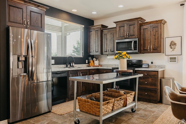480 Firestone Dr, Santaquin, UT 84655 - kitchen featuring appliances with stainless steel finishes, dark brown cabinets, recessed lighting, and light stone finish flooring