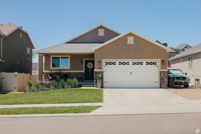 480 Firestone Dr, Santaquin, UT 84655 - view of front of home with stucco siding, an attached garage, stone siding, and concrete driveway