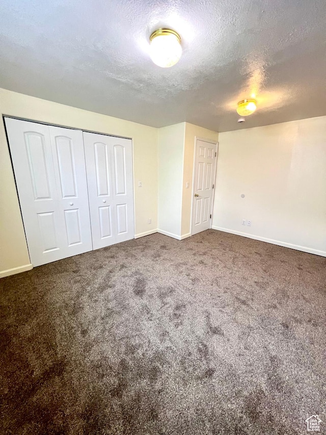 90 W 640 N, Richfield, UT 84701 - unfurnished bedroom with a textured ceiling, carpet, and a closet