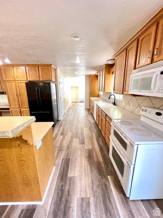 90 W 640 N, Richfield, UT 84701 - kitchen with white appliances, light countertops, dark wood-style floors, a textured ceiling, and backsplash