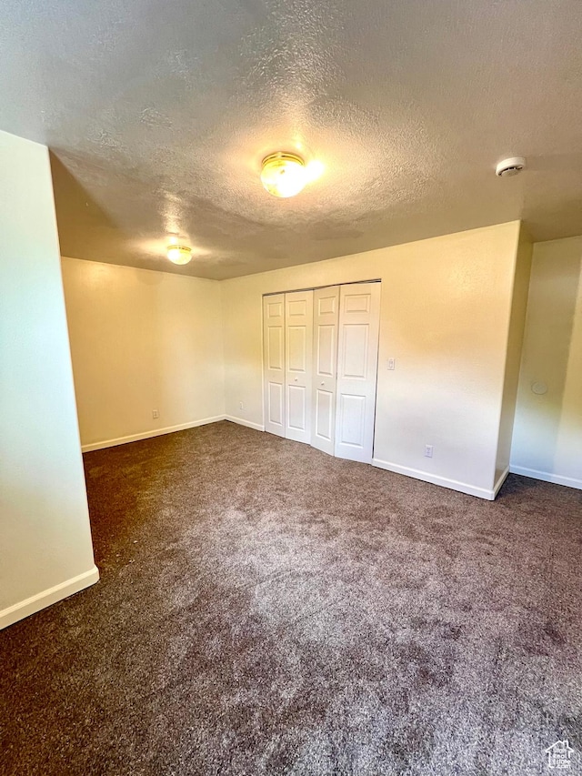 90 W 640 N, Richfield, UT 84701 - unfurnished bedroom featuring a textured ceiling, carpet floors, and a closet