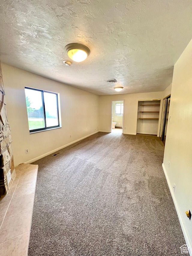 90 W 640 N, Richfield, UT 84701 - unfurnished living room with carpet flooring and a textured ceiling