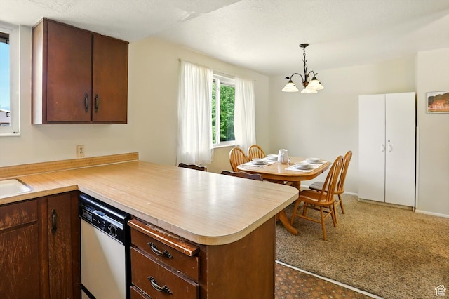 167 E 950 S, Layton, UT 84041 - kitchen with white dishwasher, a peninsula, light countertops, a chandelier, and decorative light fixtures