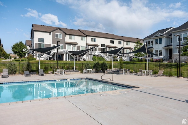 1454 N 3830 W Unit 303, Lehi, UT 84043 - community pool with a patio and a residential view