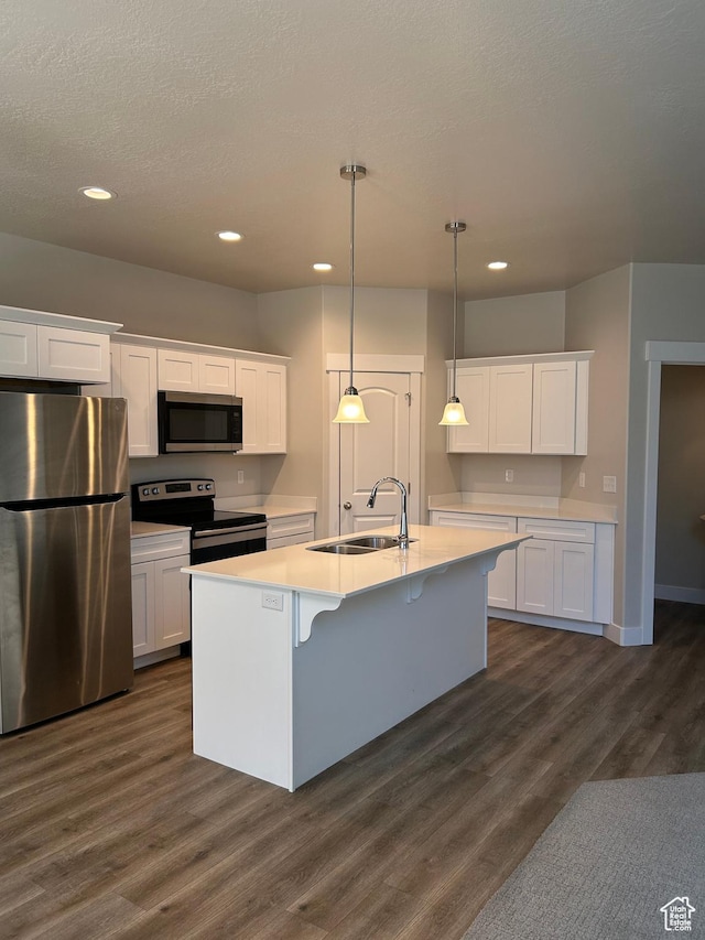 269 W 700 N, Vineyard, UT 84059 - kitchen with stainless steel appliances, white cabinetry, recessed lighting, dark wood-style floors, and light countertops