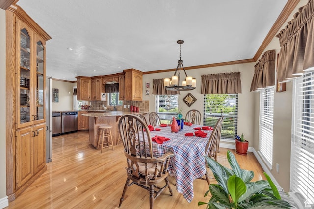 315 E Oak Ln, Kaysville, UT 84037 - dining area with light wood-style floors, healthy amount of natural light, crown molding, a chandelier, and recessed lighting
