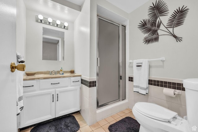 315 E Oak Ln, Kaysville, UT 84037 - full bath with tile patterned floors, tile walls, vanity, a shower stall, and a wainscoted wall