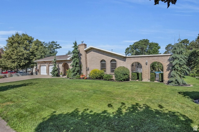 315 E Oak Ln, Kaysville, UT 84037 - view of front of property featuring a front lawn, driveway, an attached garage, brick siding, and a chimney