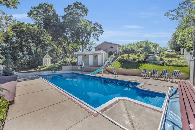 315 E Oak Ln, Kaysville, UT 84037 - swimming pool featuring a patio area, a shed, and a water slide