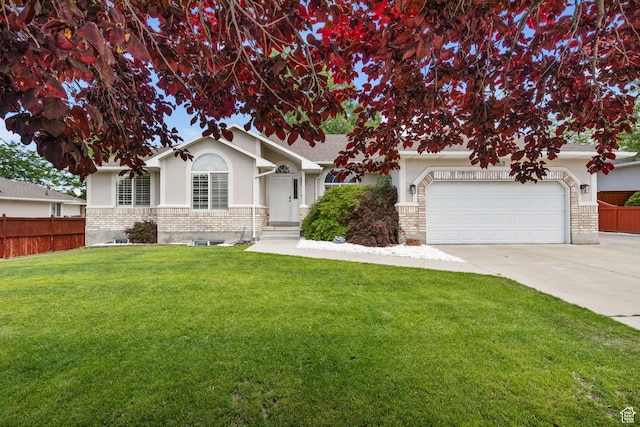 9353 S 4460 W, West Jordan, UT 84088 - view of front of property with driveway, an attached garage, and stucco siding