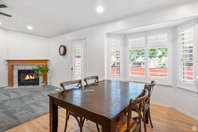 9353 S 4460 W, West Jordan, UT 84088 - dining area featuring plenty of natural light, light wood-style flooring, a tile fireplace, recessed lighting, and ceiling fan