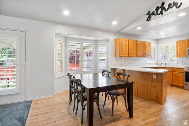 9353 S 4460 W, West Jordan, UT 84088 - dining space with light wood-style floors, recessed lighting, and lofted ceiling
