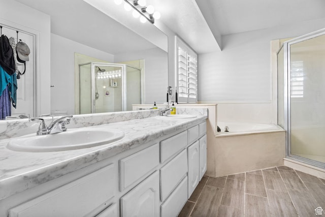 9353 S 4460 W, West Jordan, UT 84088 - bathroom with a shower stall, double vanity, a bath, and wood finished floors