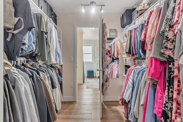 5718 W Silver Rose Cir S, Herriman, UT 84096 - walk in closet featuring light wood-style flooring