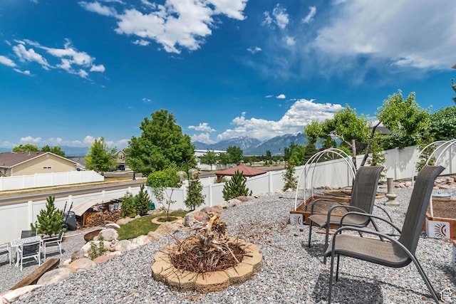 5718 W Silver Rose Cir S, Herriman, UT 84096 - fenced backyard with a mountain view and a patio area