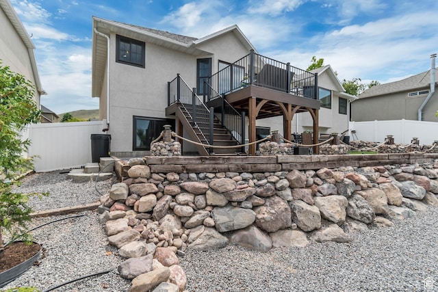 5718 W Silver Rose Cir S, Herriman, UT 84096 - back of house with a deck, stairway, and stucco siding