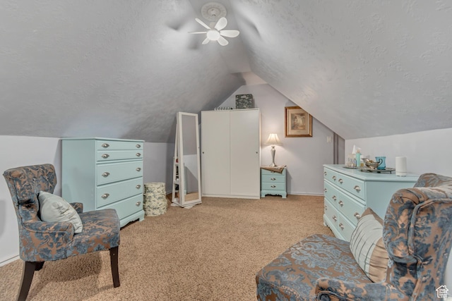 5718 W Silver Rose Cir S, Herriman, UT 84096 - sitting room featuring a textured ceiling, a ceiling fan, vaulted ceiling, and light colored carpet