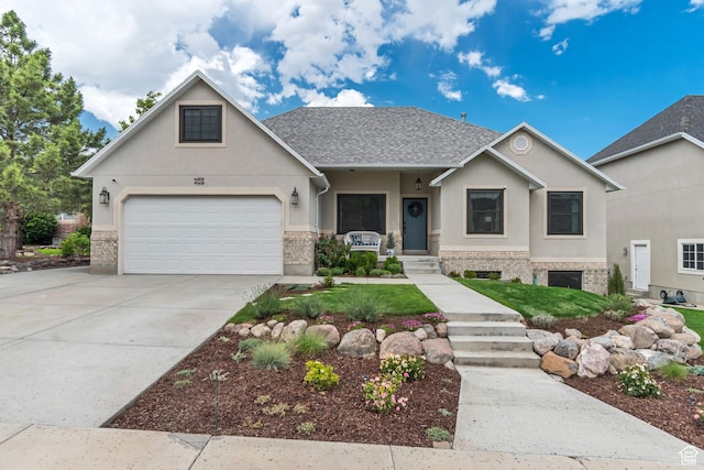 5718 W Silver Rose Cir S, Herriman, UT 84096 - view of front of home featuring stucco siding, driveway, and roof with shingles