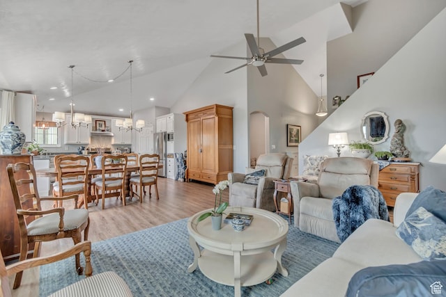 5718 W Silver Rose Cir S, Herriman, UT 84096 - living area with a chandelier, light wood-type flooring, ceiling fan, high vaulted ceiling, and recessed lighting