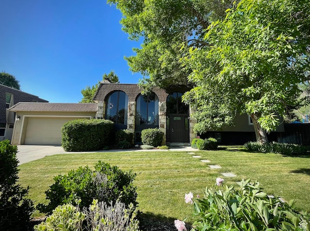 3411 E Enchanted View Dr S, Cottonwood Heights, UT 84121 - view of front of property with an attached garage, a front yard, driveway, and stone siding