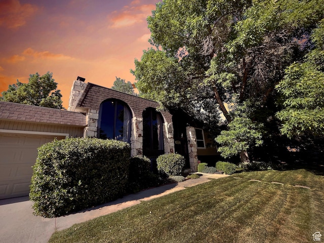 3411 E Enchanted View Dr S, Cottonwood Heights, UT 84121 - view of front property featuring an attached garage and a front lawn