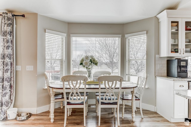 2631 Black Walnut Dr, North Logan, UT 84341 - dining space with light wood-type flooring and baseboards