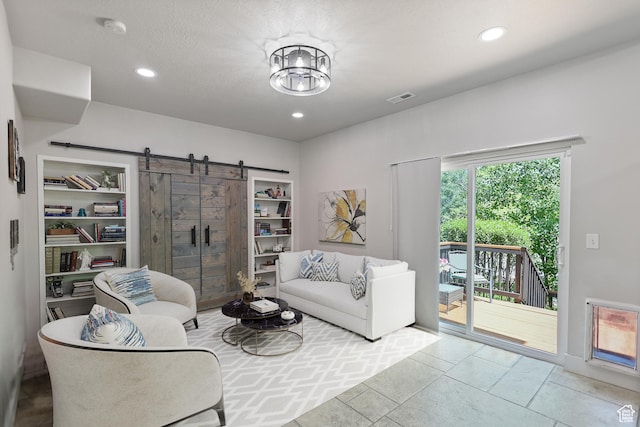 10787 S Pine Shadow Rd, South Jordan, UT 84009 - living room with a barn door, recessed lighting, and tile patterned flooring