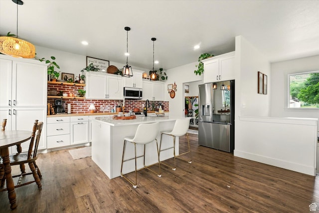 155 N 200 E, Richmond, UT 84333 - kitchen featuring stainless steel appliances, open shelves, light countertops, dark wood-style flooring, and white cabinetry