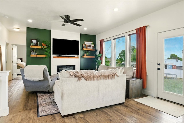 155 N 200 E, Richmond, UT 84333 - living area featuring a ceiling fan, wood finished floors, a glass covered fireplace, and recessed lighting