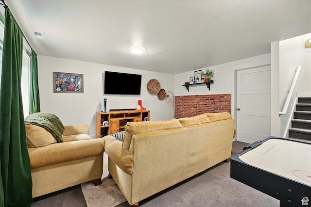155 N 200 E, Richmond, UT 84333 - carpeted living area featuring stairs and brick wall