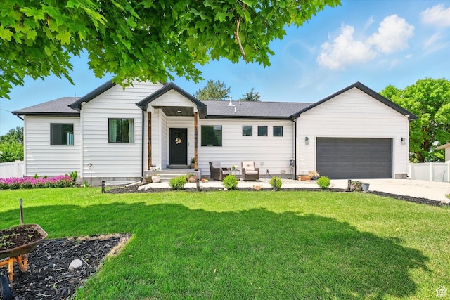 155 N 200 E, Richmond, UT 84333 - view of front of home with an attached garage, concrete driveway, and roof with shingles