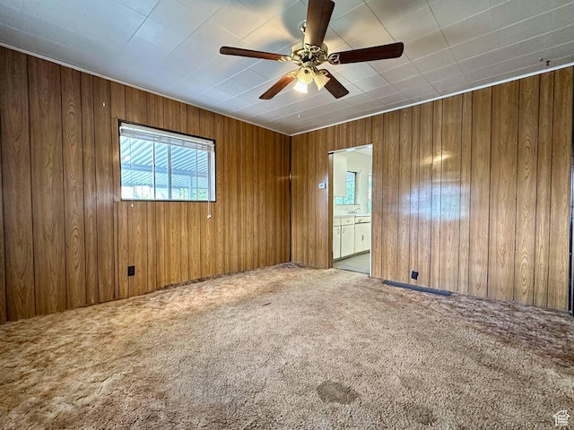 348 S Carbon Ave, Price, UT 84501 - carpeted spare room featuring wooden walls and ceiling fan