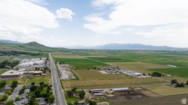 297 S 200 W, Richmond, UT 84333 - aerial view of property's location with rows of crops, a mountain backdrop, and rural landscape
