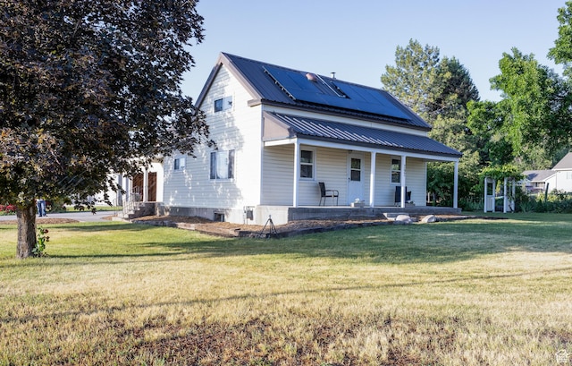 297 S 200 W, Richmond, UT 84333 - view of front of property with a porch, solar panels, a front yard, and a metal roof