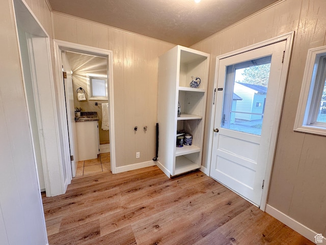 297 S 200 W, Richmond, UT 84333 - foyer featuring light wood-type flooring and crown molding
