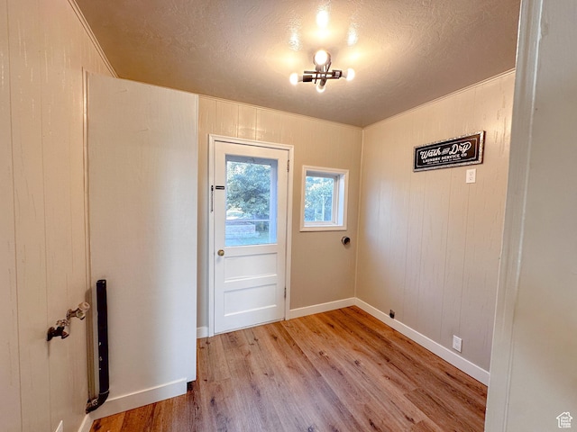 297 S 200 W, Richmond, UT 84333 - doorway featuring light wood finished floors and a textured ceiling