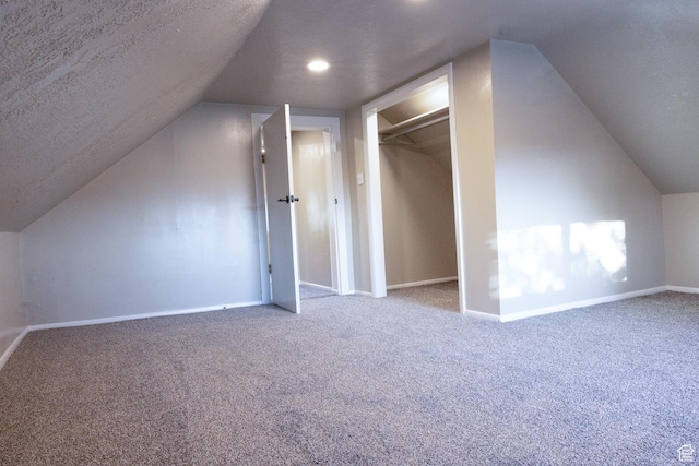 297 S 200 W, Richmond, UT 84333 - additional living space featuring carpet flooring, vaulted ceiling, and a textured ceiling