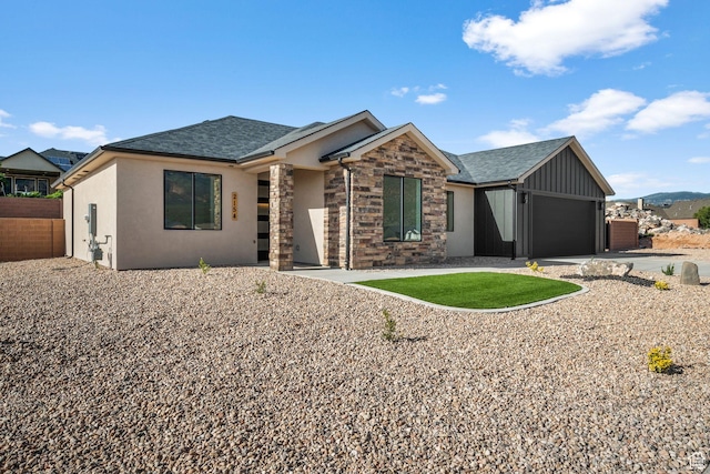 2154 S Bluff Dr, Cedar City, UT 84720 - view of front of house with a garage, a shingled roof, stucco siding, and driveway