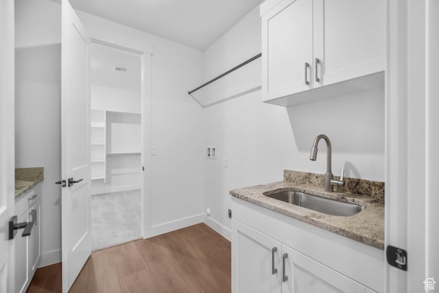 2154 S Bluff Dr, Cedar City, UT 84720 - washroom featuring hookup for a washing machine, dark wood-type flooring, and cabinet space