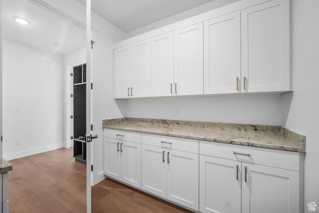 2154 S Bluff Dr, Cedar City, UT 84720 - kitchen featuring wood finished floors, white cabinets, and light stone countertops