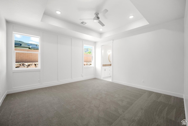 2154 S Bluff Dr, Cedar City, UT 84720 - unfurnished bedroom with a raised ceiling, carpet floors, recessed lighting, ensuite bath, and ceiling fan
