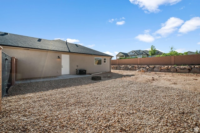 2154 S Bluff Dr, Cedar City, UT 84720 - back of house featuring stucco siding, a fenced backyard, and a patio area