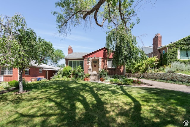 2359 E Bryan Ave S, Salt Lake City, UT 84108 - view of front of house with brick siding and a front yard