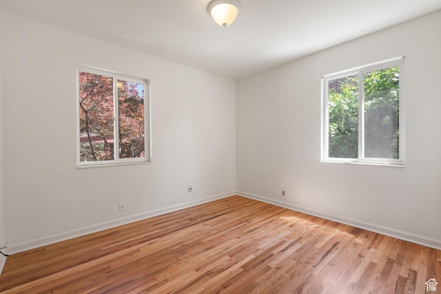 2359 E Bryan Ave S, Salt Lake City, UT 84108 - spare room with healthy amount of natural light and light wood-style floors