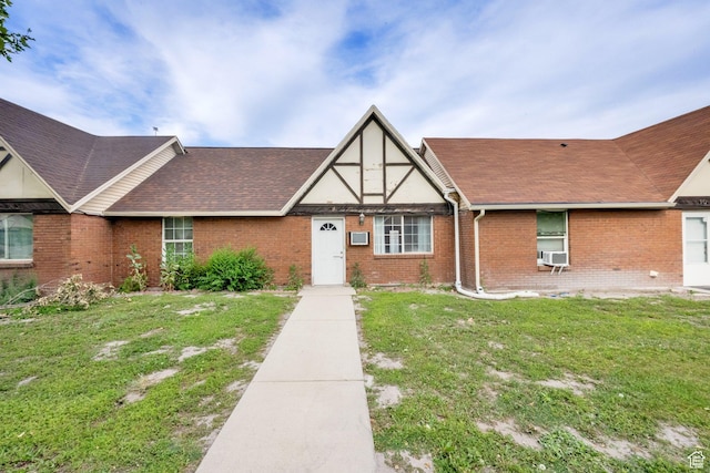 710 N 800 W Unit 11, Salt Lake City, UT 84116 - view of front of house with brick siding, a front yard, roof with shingles, and cooling unit