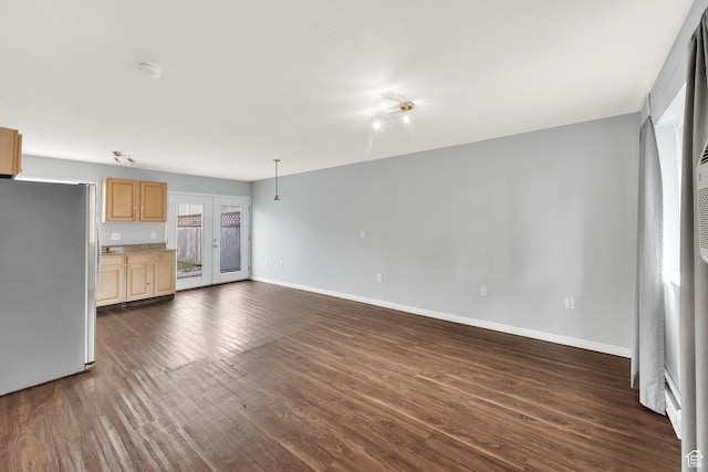 710 N 800 W Unit 11, Salt Lake City, UT 84116 - unfurnished living room featuring dark wood-type flooring and baseboards